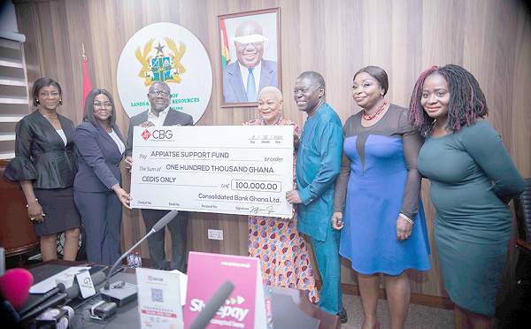 Mr Daniel Addo (3rd left) joined by his management team to his right to present the cheque to Rev. Dr Joyce Aryee (4th right), Chairperson of Appiatse Support Fund.
